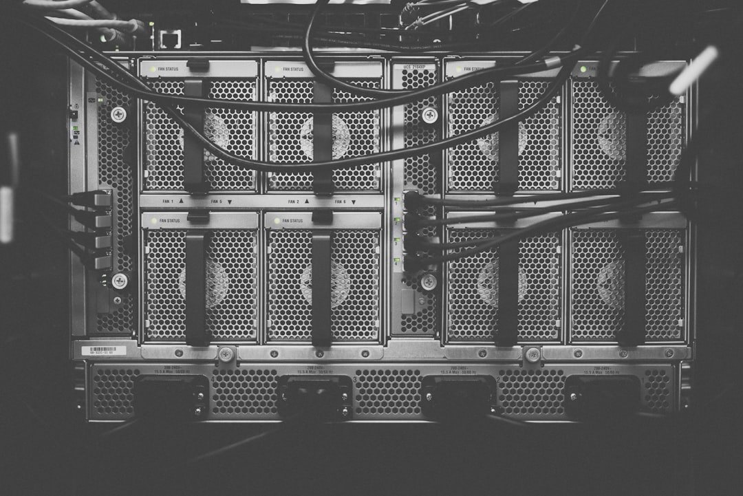 Modern data center with rows of server racks illuminated by blue LED lights